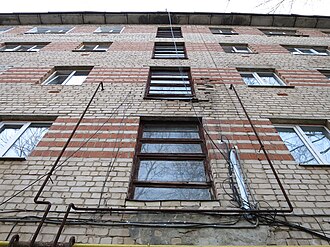 Brickwork made of ceramic and silicate bricks, stairwell windows of building 1-447 in Arzamas