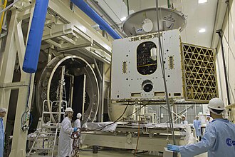 MPO being placed in Phenix thermal vacuum test facility