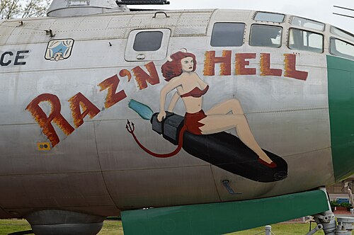 Nose art on B-29A Superfortress "Raz'n Hell", Kilroy is seen in the top left corner.