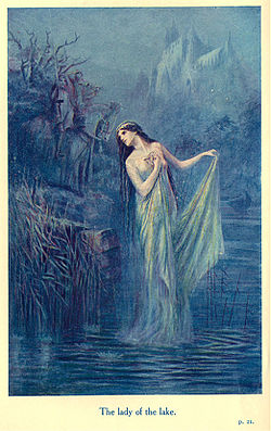 Enchantress rising from a mystical lake holding the sword Excalibur