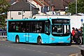 A lime colored Volvo B8RLE with MCV Evora body, operated by Arriva Wales