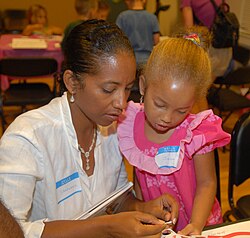 A parent and child engage in joint attention.