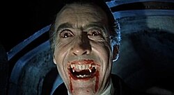 Film still of Christopher Lee wearing red contact lenses