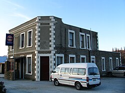 The Highwayman Hotel at Dunback, built from local schist and limestone in 1864.