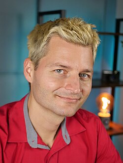 Example of a portrait using a contemporary Edison-style light bulb in the background.