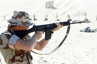 A United States Marine with a British L1A1 SLR, during a training exercise as part of the Gulf War's Operation Desert Shield