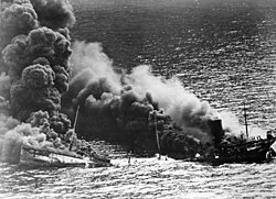 Dixie Arrow breaking in two, with fire engulfing both parts