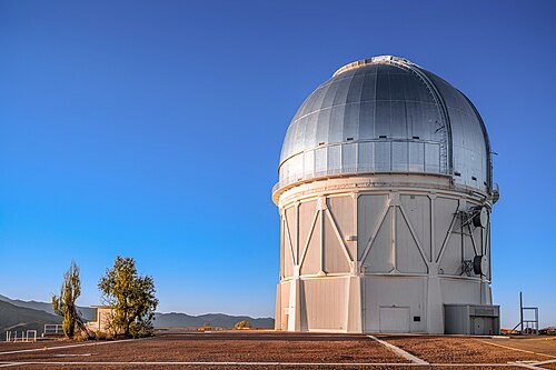 Photograph of the Víctor M. Blanco Telescope in daylight. This telescope was used to discover Halimede in 2002.