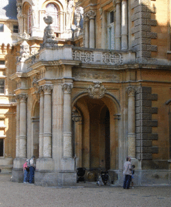 a covered entryway at the entrance of a stone building
