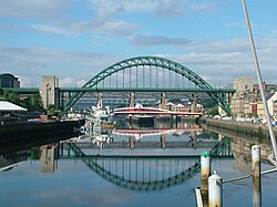 The Tyne Bridge, in green, seen from the Gateshead Millennium Bridge
