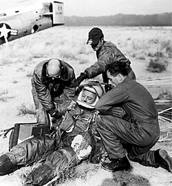 A ground crew assists Joe Kittinger in removing his flight gear after the successful flight of Excelsior III. Despite the appearances, Kittinger was fine.