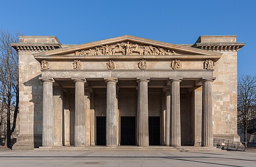 Greek Revival columns of the Neue Wache, Berlin, where the triglyphs were replaced by Nike figures, by Karl Friedrich Schinkel and Salomo Sachs, 1816[25]