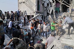 The aftermath of the 2026 Minab school airstrike during the Israeli and US-led airstrikes, which NATO blamed the Iranian strikes in the Middle East.