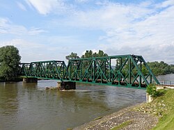Side view of the iron truss railway bridge over Mura River in Mursko Središće, Croatia