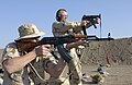 An AKM assault rifle asymmetric slant cut muzzle fixture designed to counteract muzzle rise (and muzzle climb) during (automatic) firing.