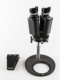 Zeiss; fixed magnification which can be adjusted by fitting new objective lenses.