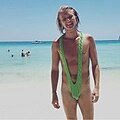 A man wearing a sling swimsuit