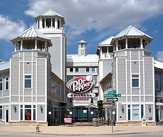 The home plate façade of the ballpark features gray siding and turret roofs.