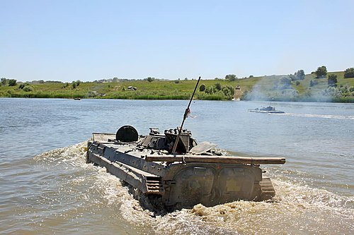 Ukrainian BMP-1s, undertake a water crossing during a training exercise.
