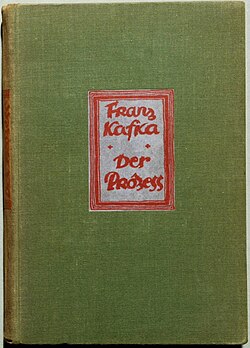 Photo of a green book cover with the red text "Franz Kafka Der Prozess"