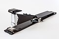 A long-reach stapler is used to staple items such as booklets.