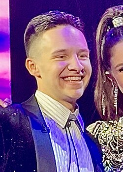Blocker poses for pictures during a commercial break on American Idol in May 2024.