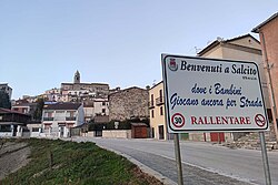 Welcome to Salcito sign with town in background