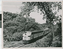 A Chicago and North Western Railway locomotive traveling through trees