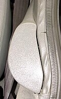 Early-style two-piece armrest extension on a DeLorean