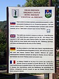 Sign with information on the castle in Slovak, German, English and French (August 2008)