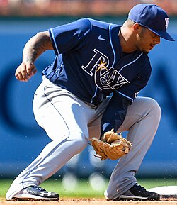 Wander Franco of the Tampa Bay Rays, crouching and wearing a baseball glove and uniform