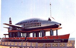 A building that is shaped like an aeroplane.