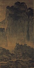 Fan Kuan ( 960–1030), Travellers among Mountains and Streams (), ink and slight color on silk, dimensions of 6.75 ft × 2.5 ft (2.06 m × 0.76 m). 11th century, China. National Palace Museum, Taipei