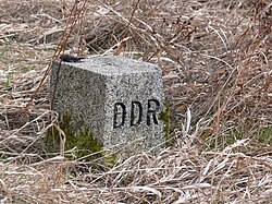 An East German boundary stone with the letters "DDR" (Deutsche Demokratische Republik) carved on the western-facing edge.This one is at Freilandmuseum Behrungen, Thuringia