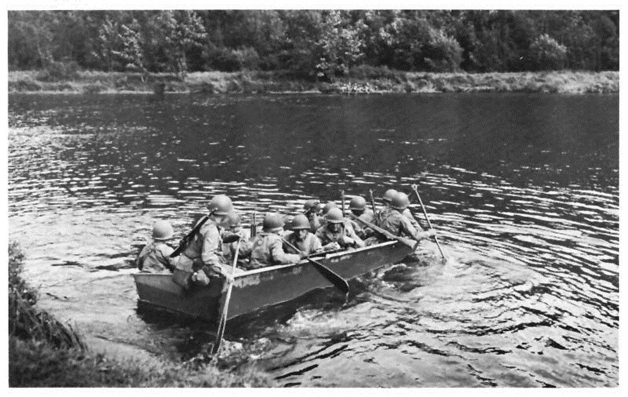 U.S. infantry soldiers deploying an M2 assault boat in Europe in World War II.jpg