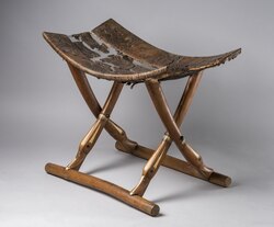 Wooden stool with x-shaped legs