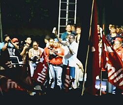 A photograph of Mauricio Funes at a campaign rally
