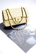 Chanel handbag in quilted-leather with adjustable double-chains to wear on the arm or shoulder.
