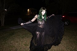 Kitty Ray in a long black dress