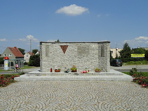 Memorial in Zgorzelec, Poland, with a P-symbol on a red triangle