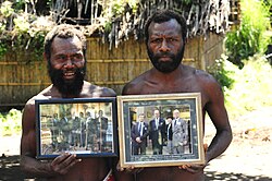 Yaohnanen Tribesmen with photos of Prince Philip