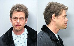Vince Offer is wearing a jacket and blue shirt. In the left mugshot, he is facing the camera and has a bloodied lip. In the right mugshot, he is facing to the side.