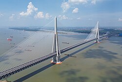 The Changtai Yangtze River Bridge in Jiangsu province, China has a main span of 1,176 metres (3,858 ft), the world's longest cable-stayed bridge span as of 2026.