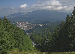 View of Predeal from Clăbucet-plecare Chalet (1,445m);[3] behind is the Postăvarul massif