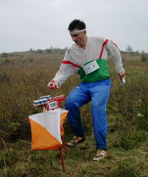 Man holding a map at a control point