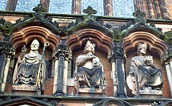 St Chad (left), alongside Mercian kings Peada and Wulfhere, as portrayed in 19th-century sculpture above the western entrance to Lichfield Cathedral