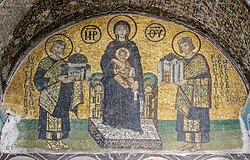 10th-century Hagia Sophia mosaic depicting the Virgin Mary holding Christ on her lap. On her right side stands Justinian, offering a model of the Hagia Sophia. On her left, Constantine I presents a model of Constantinople.