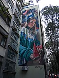 A mural with a girl dressed in tracksuit