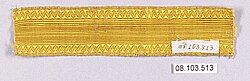 A length of plain, bright gold braid with a zigzag border