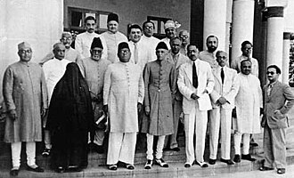 Muhammad Ali Jinnah (center) and Liaquat Ali Khan (far left), both in churidars at the All-India Muslim League Working Committee meeting (March 1940)